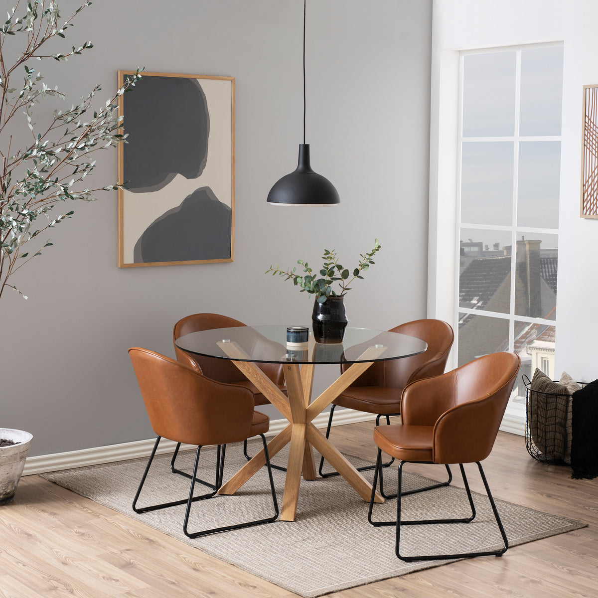 Stela Round Glass Dining Table 119x76 cm, Modern Style – in a room setting