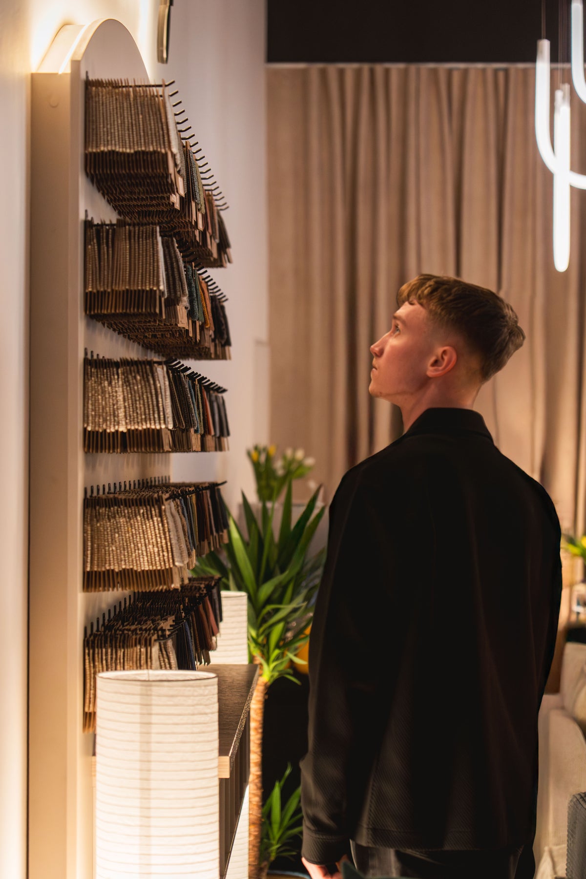 Man looking at fabric samples in the Pillovely showroom