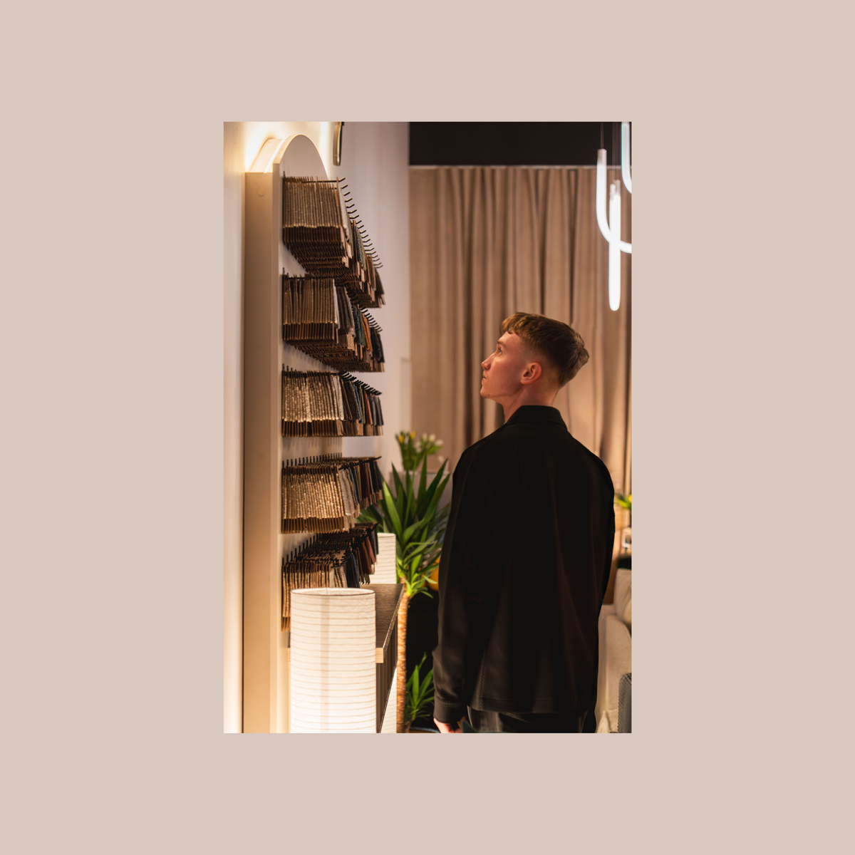 Man looking at fabric samples in the Pillovely showroom
