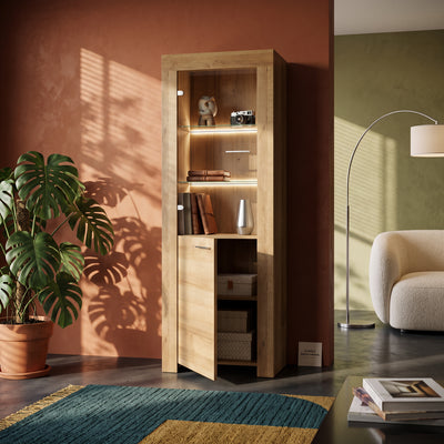 Gorky Glass Display Cabinet 70x197 cm with LED Lighting, Modern Style – in a room setting