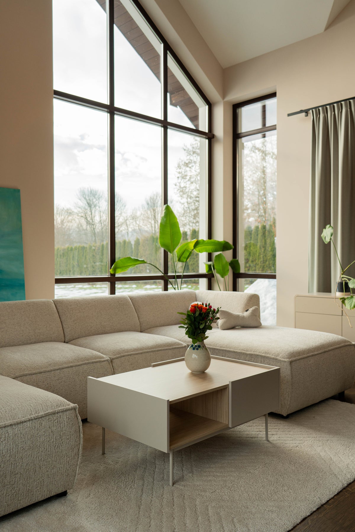 Brick modular sofa in a bright living room with large windows.